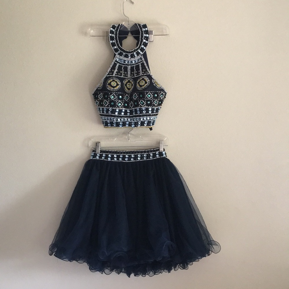 Two piece dress with jewel and bead details.